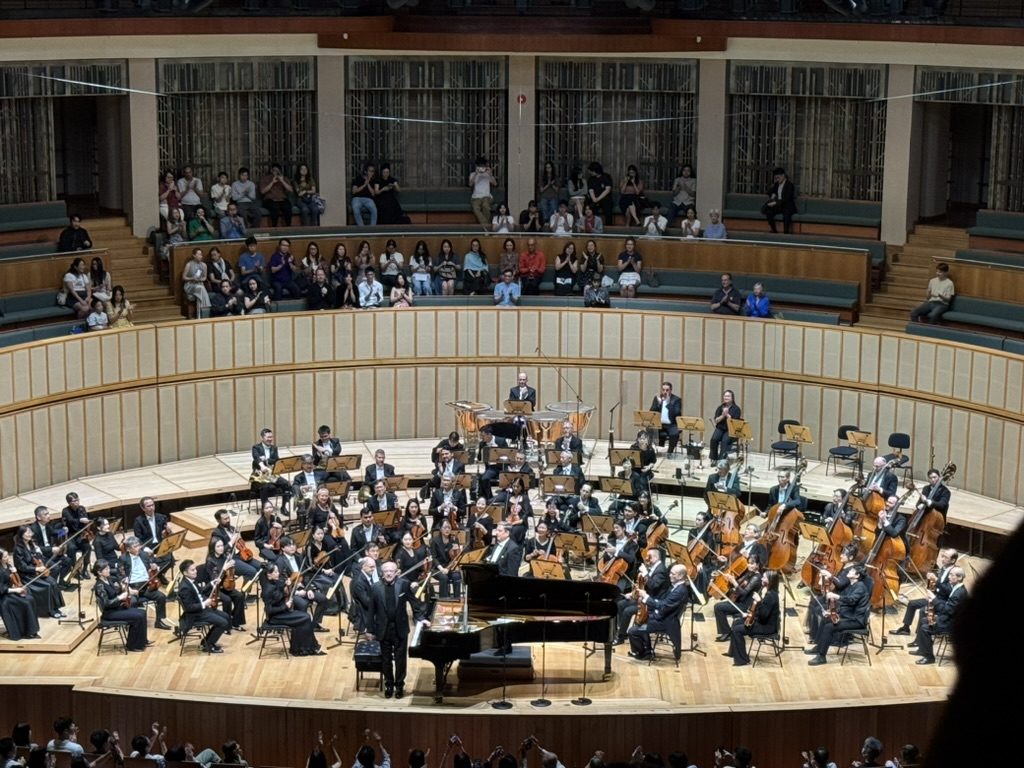Concert: Orchestra and piano.